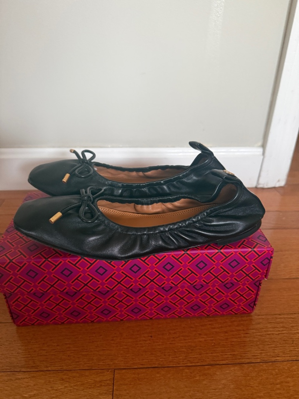Tory Burch Black Leather Ballet Flats with Bow and Gold Accents